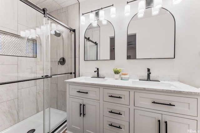 bathroom with vanity and an enclosed shower