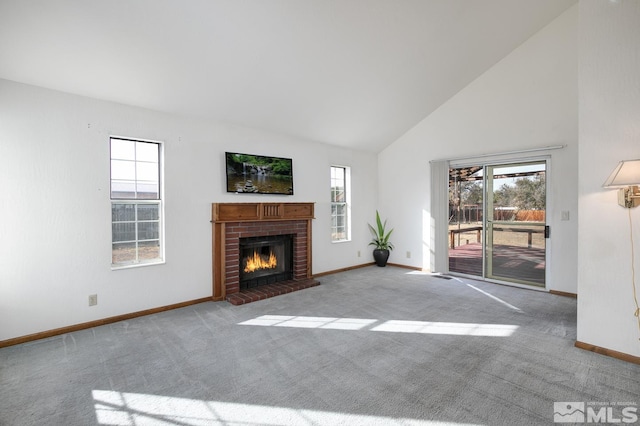 unfurnished living room featuring light colored carpet, a fireplace, and high vaulted ceiling