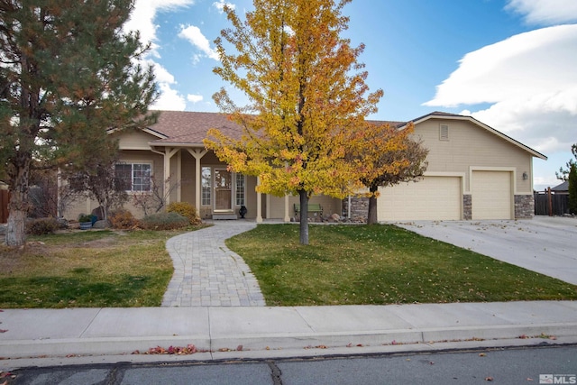 view of front of home with a garage and a front yard