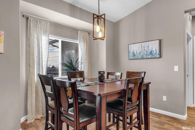 dining space featuring light wood-type flooring