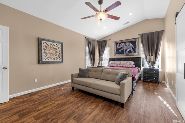 bedroom featuring dark hardwood / wood-style floors, ceiling fan, and lofted ceiling