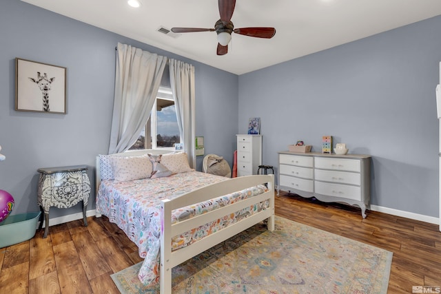 bedroom with hardwood / wood-style floors and ceiling fan