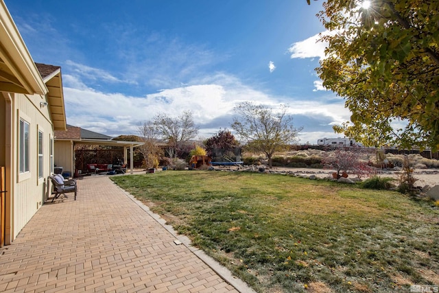 view of yard with a patio area and a trampoline