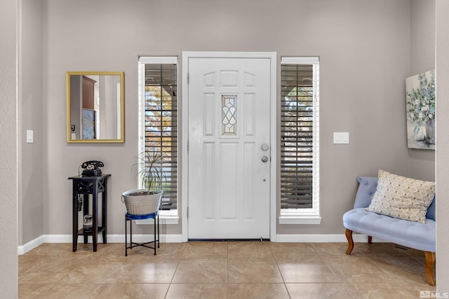 entrance foyer featuring light tile patterned flooring