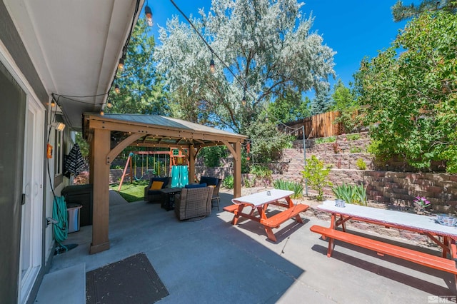 view of patio with a gazebo and a playground