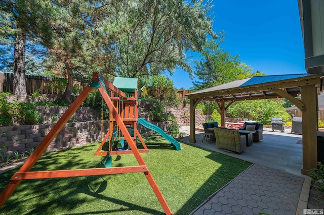 view of playground with a gazebo, a patio area, a yard, and outdoor lounge area