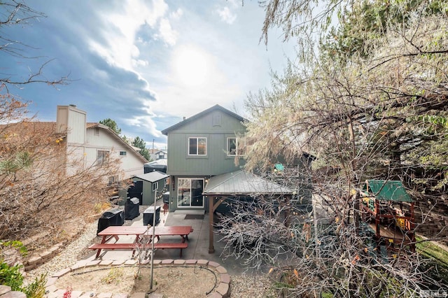 rear view of property featuring a patio