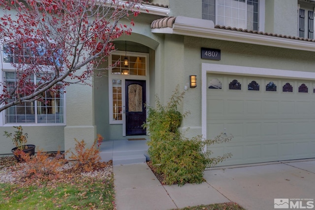 property entrance featuring a garage