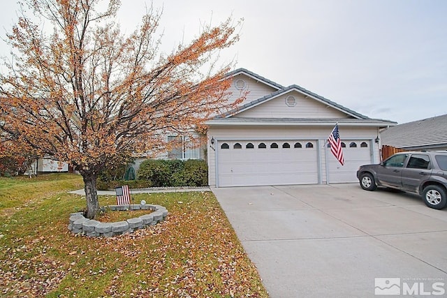 view of front facade with a front yard and a garage