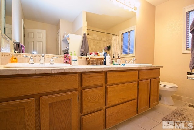 bathroom with tile patterned flooring, vanity, toilet, and a shower with shower curtain