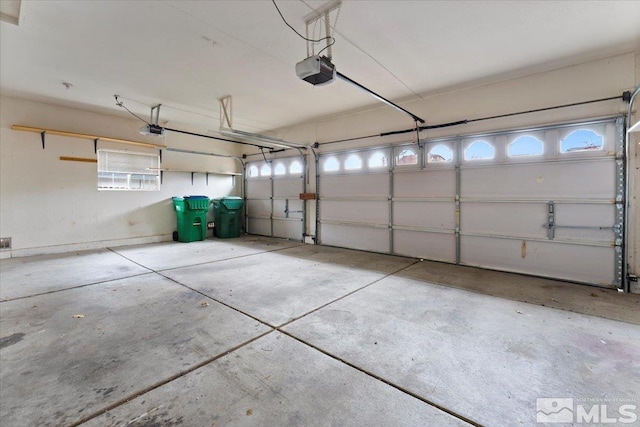 garage featuring a garage door opener