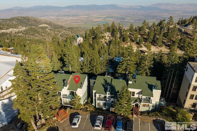 birds eye view of property featuring a mountain view