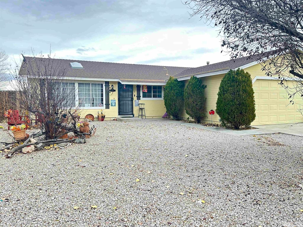 ranch-style house featuring a garage