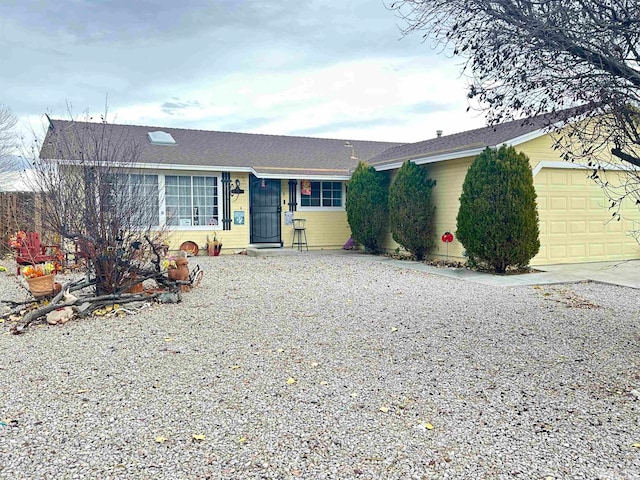 ranch-style house featuring a garage