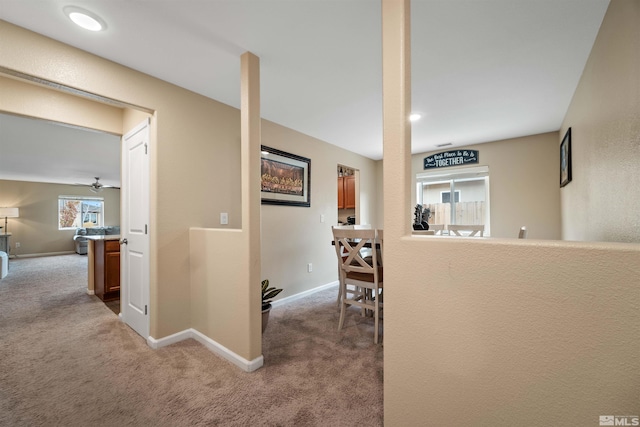 corridor with light colored carpet