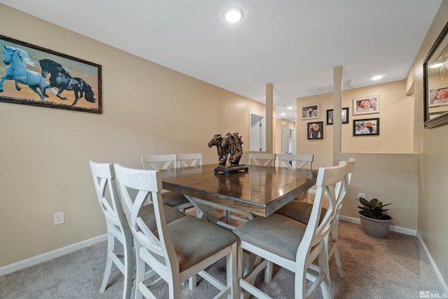 view of carpeted dining space