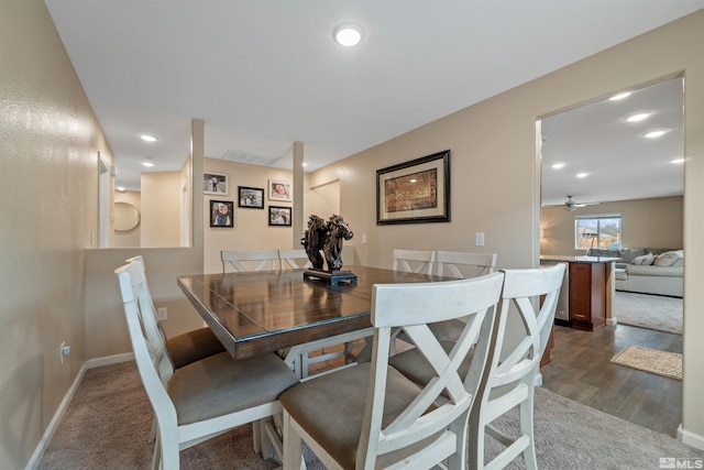 dining room featuring ceiling fan and dark hardwood / wood-style floors