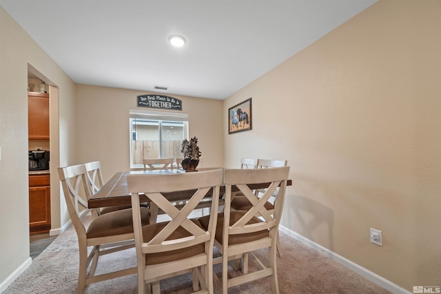 view of carpeted dining space