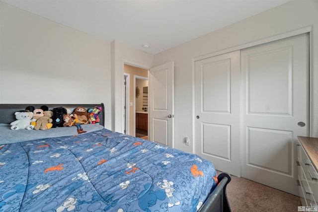 bedroom with carpet floors and a closet