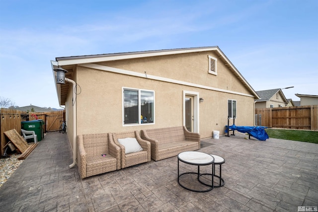 rear view of house featuring a patio