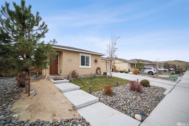 ranch-style house featuring a front yard