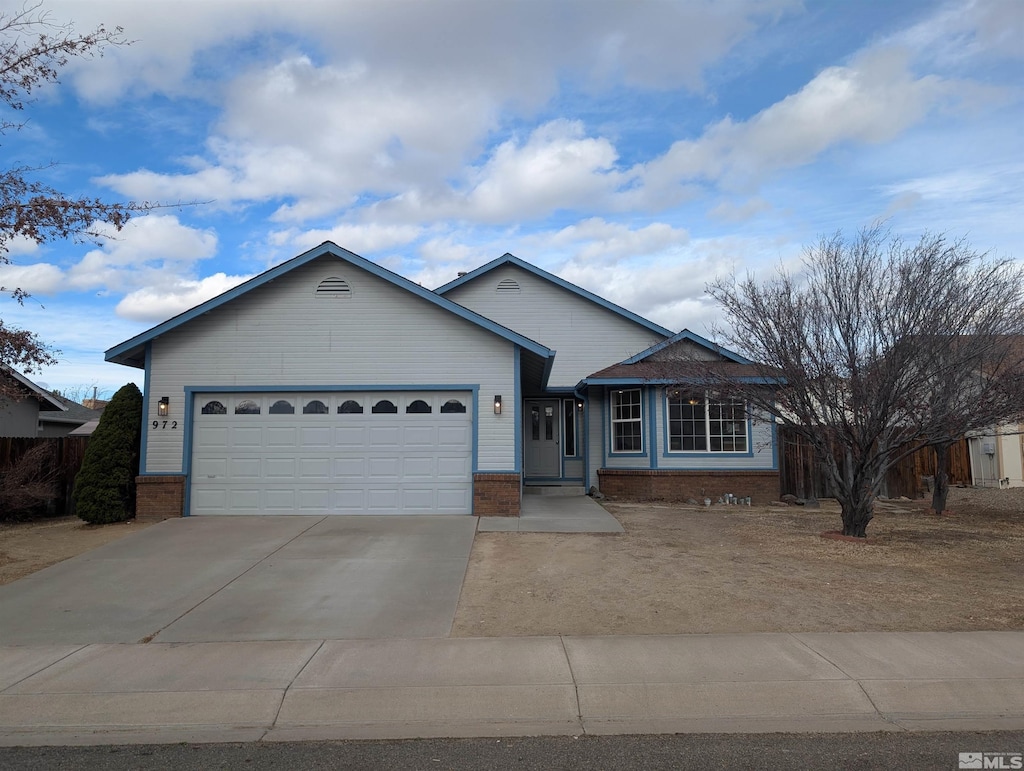 ranch-style home featuring a garage