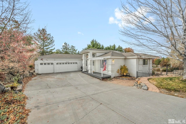 ranch-style home featuring a garage