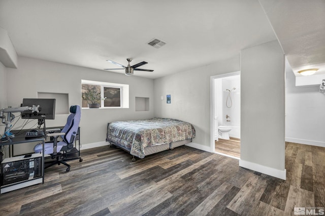 bedroom featuring ceiling fan, dark wood-type flooring, and ensuite bathroom