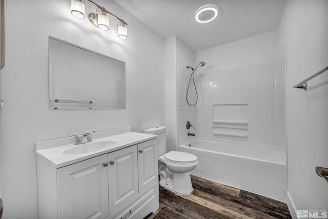 full bathroom with shower / bath combination, vanity, toilet, and wood-type flooring