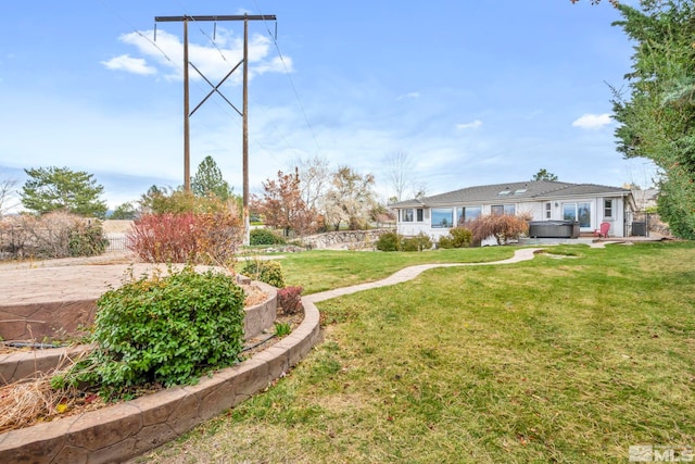 view of yard featuring a hot tub