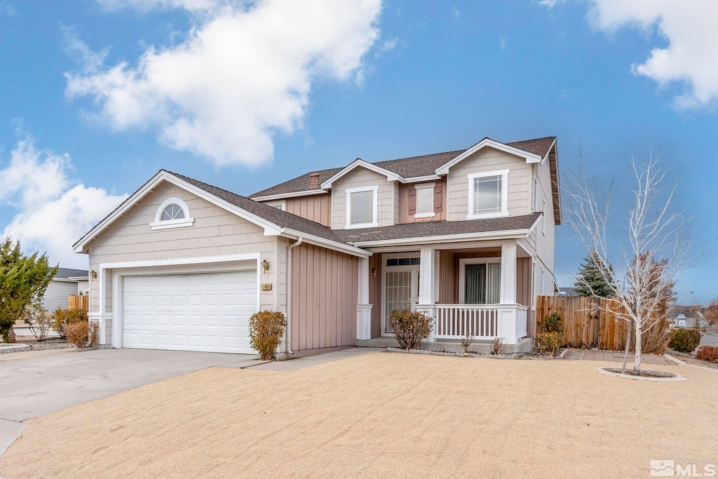 view of front of home featuring a garage and covered porch