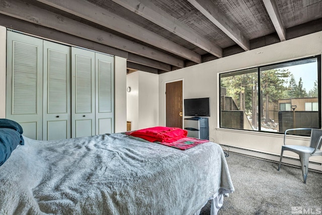 bedroom with wooden ceiling, a baseboard heating unit, carpet flooring, beam ceiling, and a closet