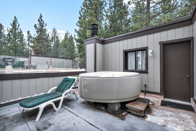 view of patio with a hot tub