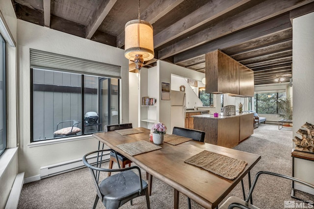 dining room with beam ceiling, wood ceiling, light carpet, and a baseboard radiator