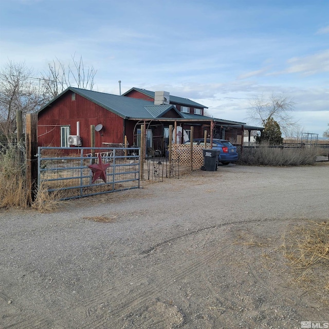 view of front of property with an outdoor structure