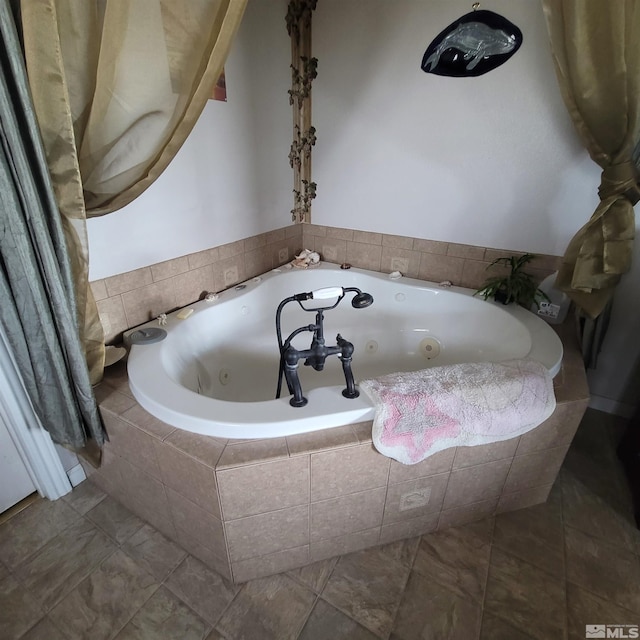 bathroom with tile patterned floors and a relaxing tiled tub