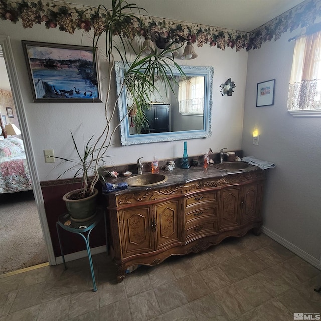 bathroom with vanity and a healthy amount of sunlight