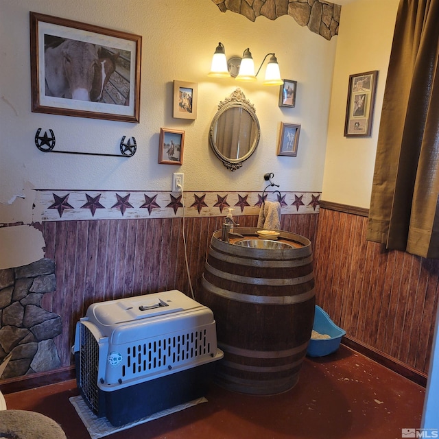 bathroom with wood walls