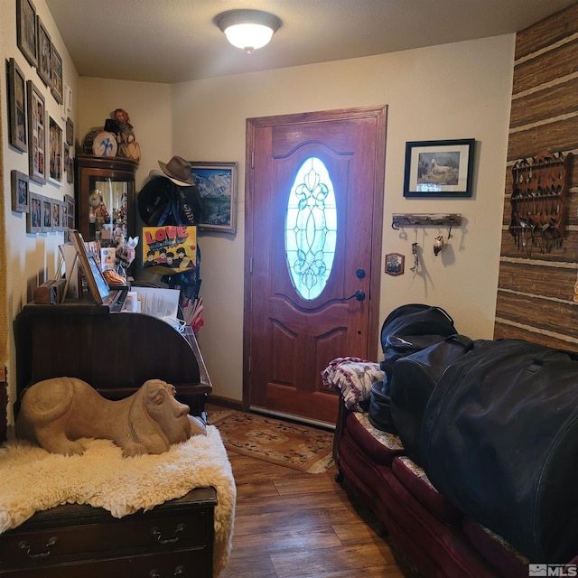 entrance foyer featuring dark hardwood / wood-style floors