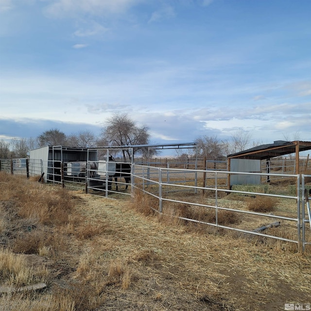 exterior space featuring an outbuilding and a rural view