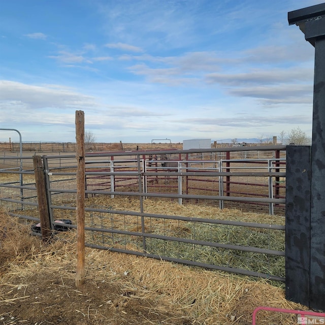 view of yard with a rural view