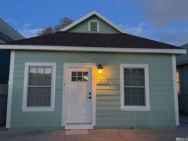 view of exterior entry at dusk