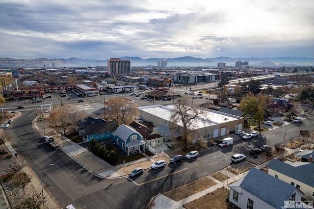 birds eye view of property with a mountain view