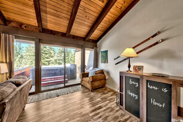 living area with vaulted ceiling with beams, wood-type flooring, and wooden ceiling