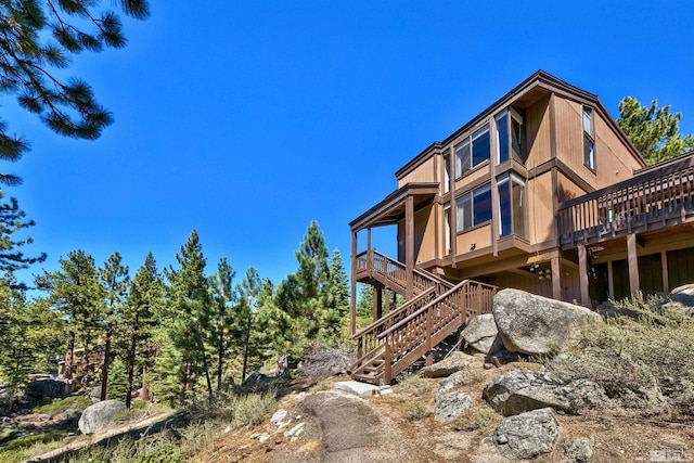 view of side of property featuring a deck