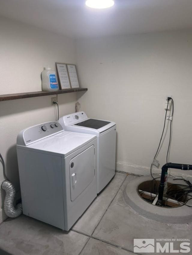 clothes washing area featuring independent washer and dryer