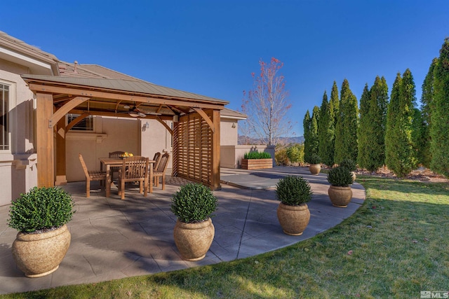 view of patio with a gazebo and ceiling fan