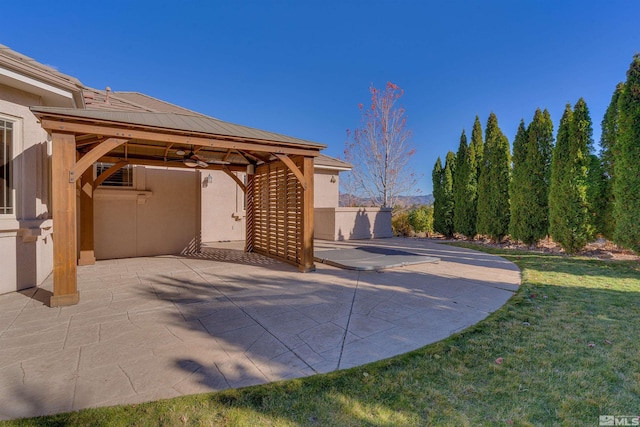 view of patio with a gazebo and ceiling fan