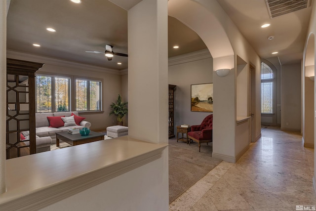 interior space with ceiling fan