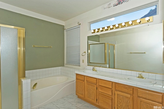 bathroom featuring vanity and independent shower and bath